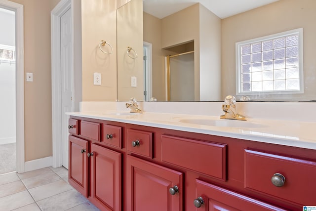 bathroom featuring walk in shower, tile patterned floors, and vanity