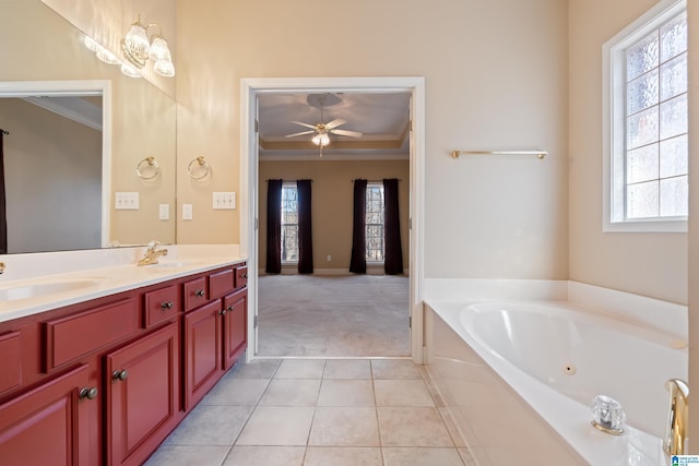 bathroom with vanity, a tub to relax in, tile patterned floors, and ornamental molding