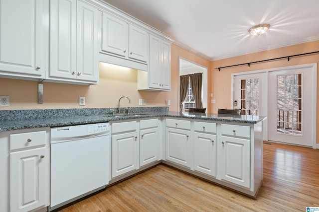 kitchen featuring sink, white cabinets, white dishwasher, kitchen peninsula, and light hardwood / wood-style flooring