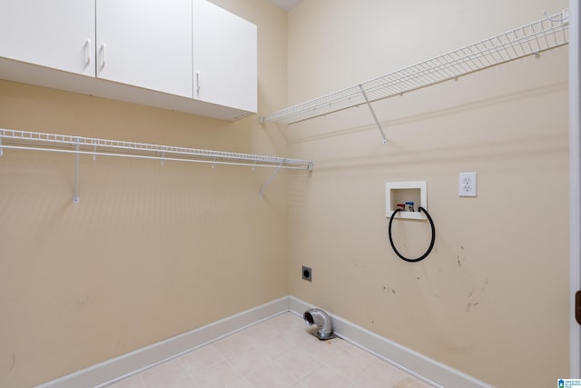 washroom featuring cabinets, washer hookup, and electric dryer hookup