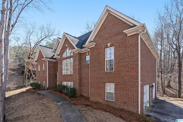 view of side of home with a garage