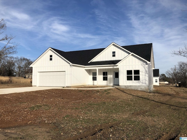 modern farmhouse featuring a garage