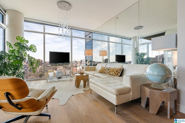 sunroom featuring an inviting chandelier