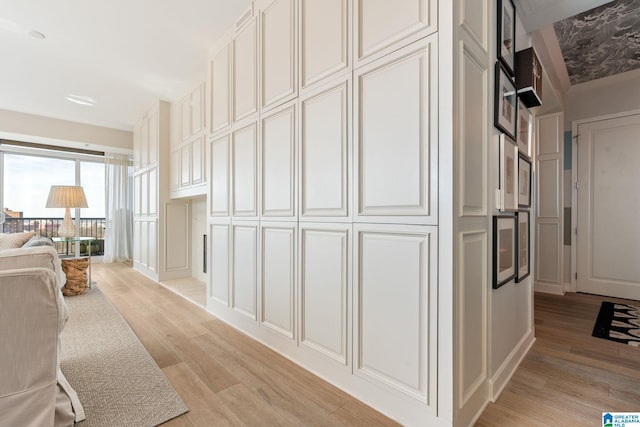 hallway with light wood-type flooring