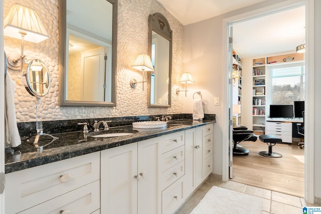 bathroom featuring hardwood / wood-style flooring and vanity