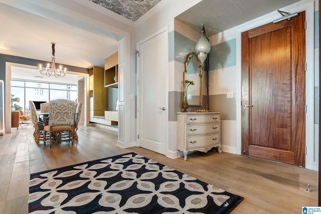 dining area with a notable chandelier and light hardwood / wood-style flooring