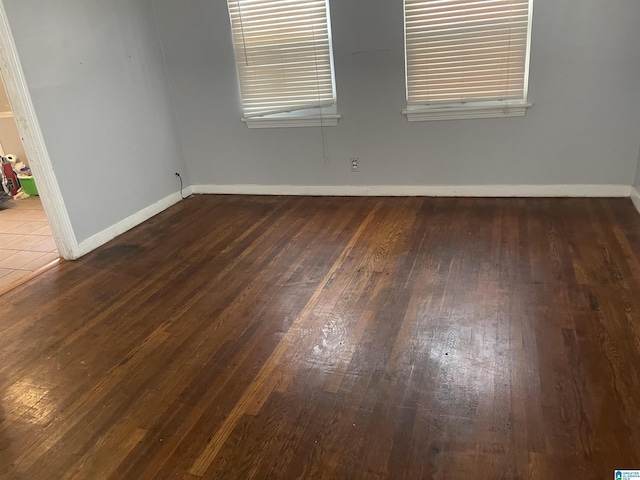 unfurnished room featuring hardwood / wood-style floors