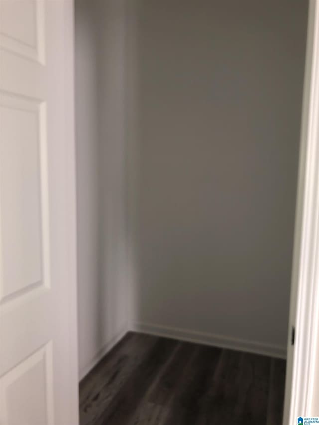 spare room with dark hardwood / wood-style floors