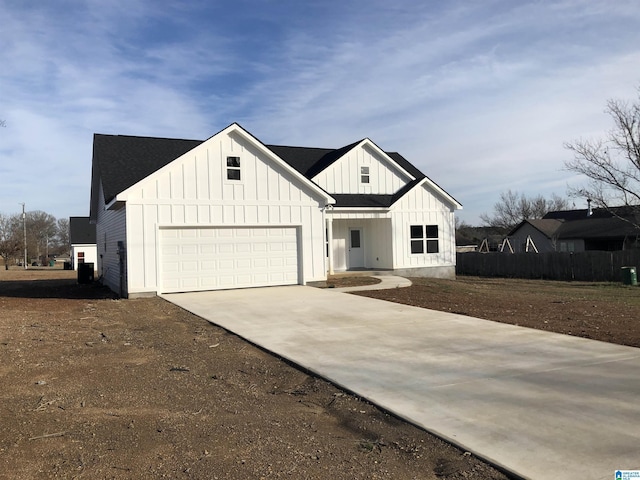 modern inspired farmhouse with a garage