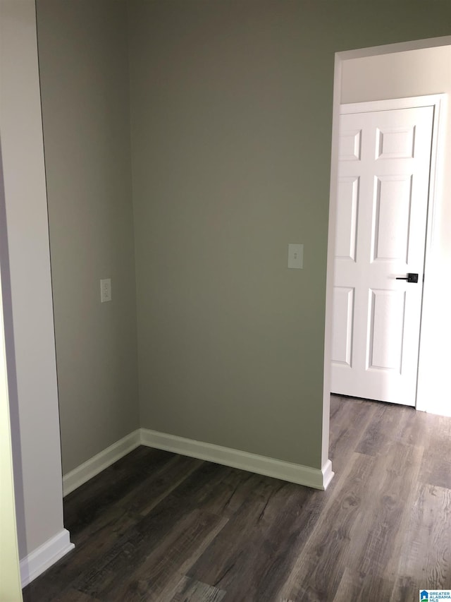 empty room with dark hardwood / wood-style floors