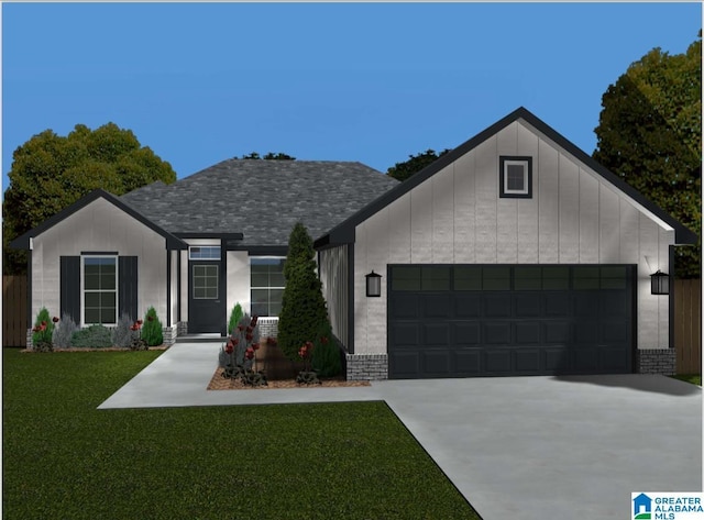 view of front facade with a garage and a front lawn