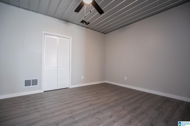 empty room featuring ceiling fan and wood-type flooring