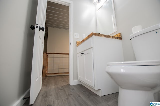 bathroom with hardwood / wood-style flooring