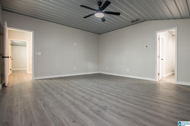 empty room featuring hardwood / wood-style floors and ceiling fan