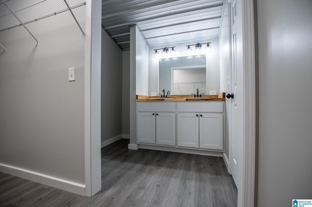 bathroom featuring hardwood / wood-style flooring and vanity