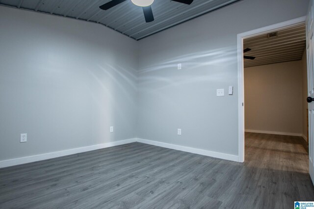 empty room featuring hardwood / wood-style floors and ceiling fan