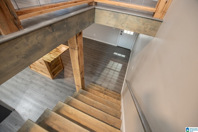 staircase featuring hardwood / wood-style flooring