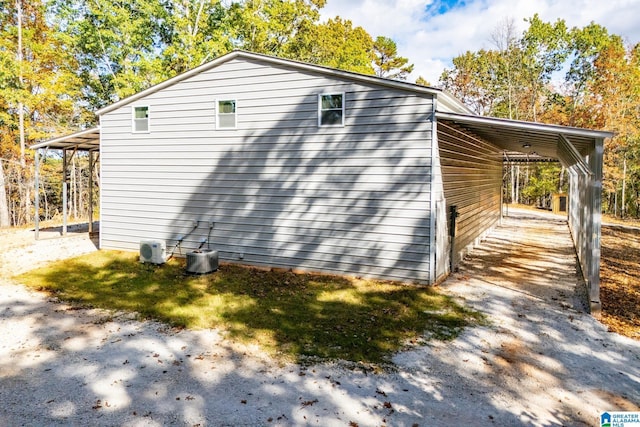 view of side of property featuring a carport