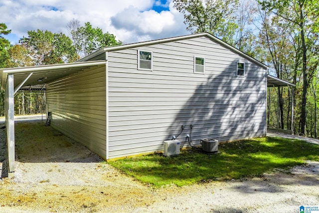 view of side of property with a carport