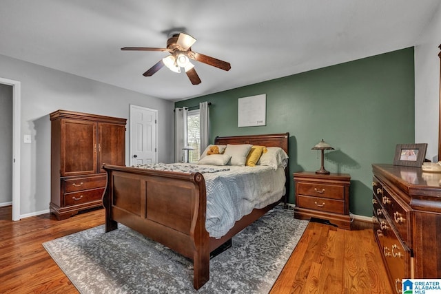 bedroom featuring hardwood / wood-style flooring and ceiling fan