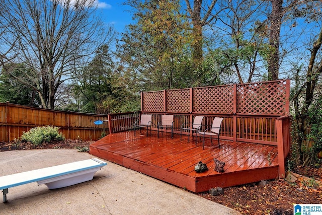 wooden terrace featuring a patio area