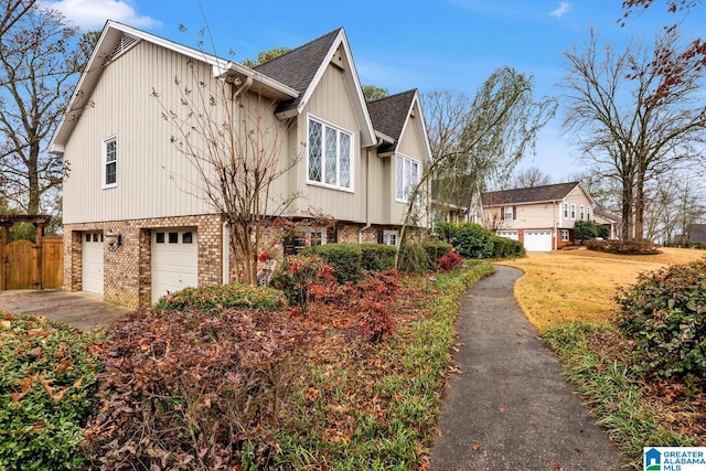 view of side of property featuring a garage