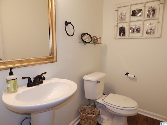 bathroom featuring sink and toilet