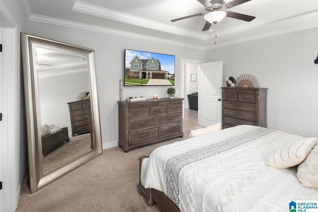 carpeted bedroom with ornamental molding and ceiling fan