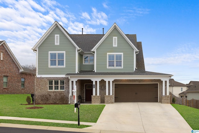 view of front of property featuring a garage and a front yard