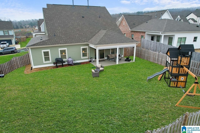 back of property with a playground, a patio, and a lawn