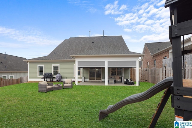 back of house with an outdoor hangout area, a patio, and a lawn