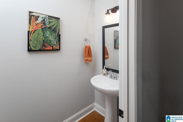 bathroom with sink and hardwood / wood-style floors