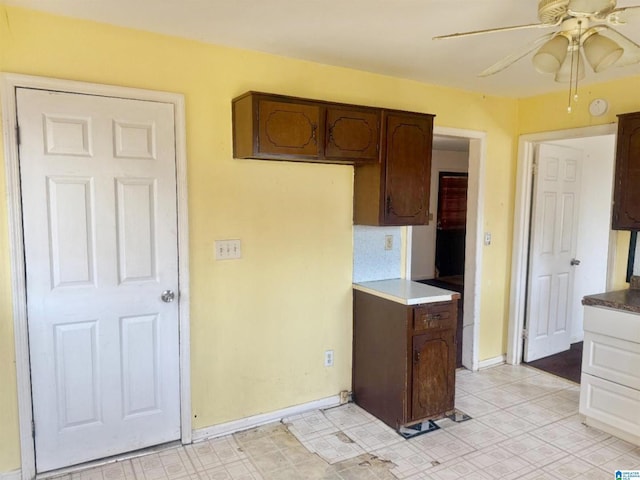 kitchen with dark brown cabinets and ceiling fan