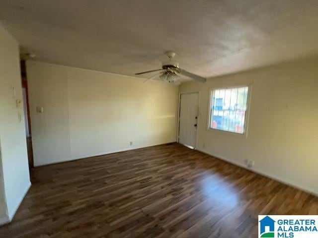 spare room featuring a ceiling fan and wood finished floors