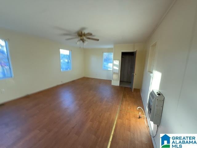 interior space with ceiling fan and wood finished floors