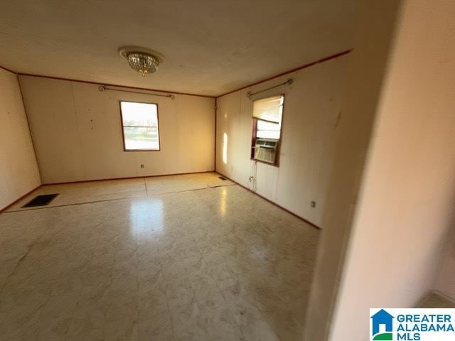 spare room with visible vents and tile patterned floors