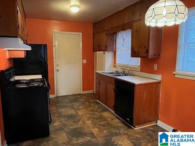 kitchen with sink and black appliances