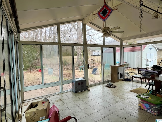 sunroom / solarium with vaulted ceiling with beams and ceiling fan