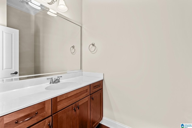 bathroom with baseboards and vanity