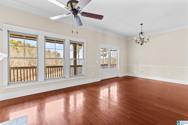 unfurnished room featuring crown molding, hardwood / wood-style flooring, and ceiling fan with notable chandelier