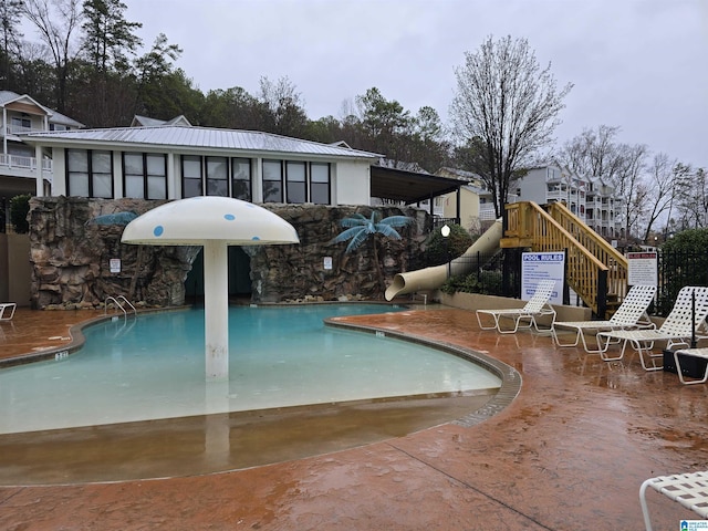 view of swimming pool with a patio area