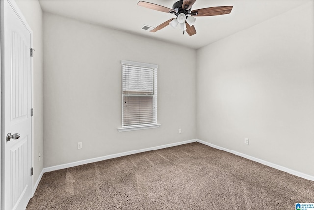 carpeted empty room featuring ceiling fan