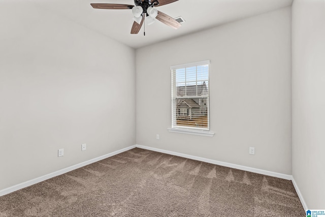 carpeted spare room with ceiling fan