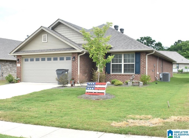 view of front of house featuring central AC, a garage, and a front yard