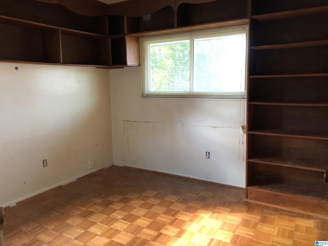 unfurnished room featuring light parquet flooring