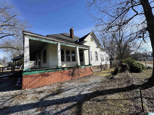 view of home's exterior featuring covered porch