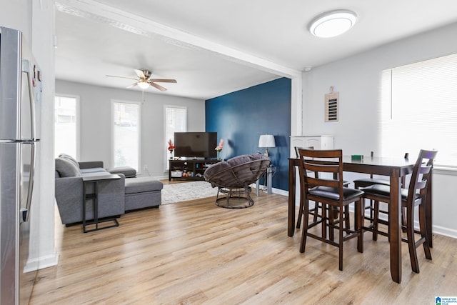 dining room featuring ceiling fan and light hardwood / wood-style flooring