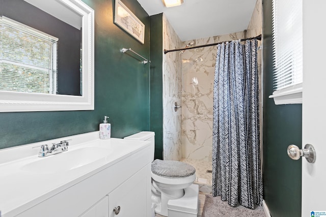 bathroom featuring vanity, a wealth of natural light, curtained shower, and toilet