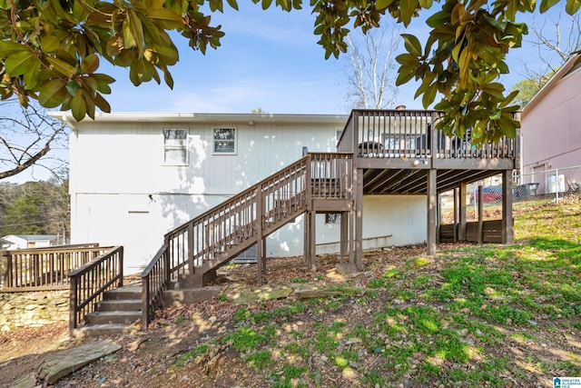 back of house featuring a deck