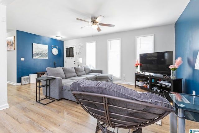 living room with hardwood / wood-style flooring and ceiling fan